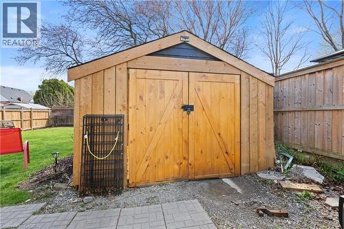 Wood-sided storage shed with a gabled roof and double barn doors - 25 East 39Th Street, Hamilton, ON - Outdoor