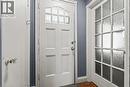 White paneled door with upper glass inserts, accompanied by a multi-paneled door featuring frosted glass - 25 East 39Th Street, Hamilton, ON  - Indoor Photo Showing Other Room 