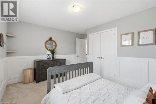 Bedroom featuring wainscoting and light gray wall paint - 47 Winners Way, Binbrook, ON - Indoor Photo Showing Bedroom