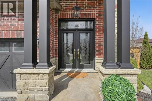 Brick facade with stone accents and a covered entry - 47 Winners Way, Binbrook, ON - Outdoor