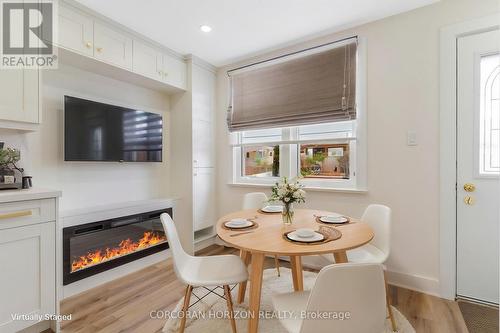 844 Stirling Avenue S, Kitchener, ON - Indoor Photo Showing Dining Room With Fireplace