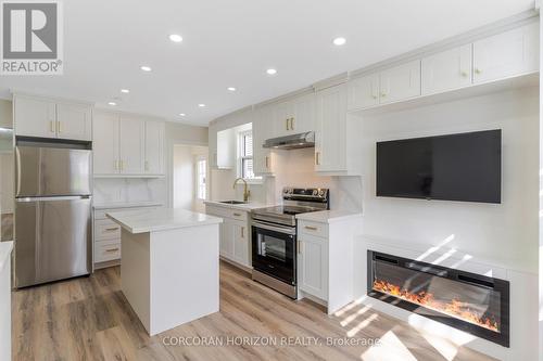 844 Stirling Avenue S, Kitchener, ON - Indoor Photo Showing Kitchen With Fireplace