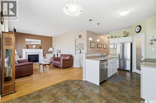 1655 Wingert Drive, Regina, SK - Indoor Photo Showing Kitchen With Fireplace With Stainless Steel Kitchen