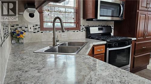 274 Front Road Unit# 88, St. Williams, ON - Indoor Photo Showing Kitchen With Double Sink