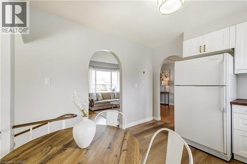 Open concept living area with light wood-finish flooring - 217 Lawnhurst Court, Hamilton, ON - Indoor Photo Showing Kitchen