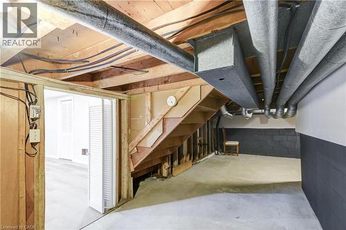 Unfinished basement space featuring exposed wood joists, concrete flooring, and visible ductwork - 217 Lawnhurst Court, Hamilton, ON - Indoor