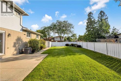 Expansive grassy yard with white perimeter fencing - 217 Lawnhurst Court, Hamilton, ON - Outdoor