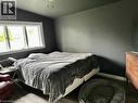 Room featuring dark gray walls, sloped ceiling, and wood-finish flooring - 126 Lilacside Drive, Hamilton, ON  - Indoor Photo Showing Bedroom 