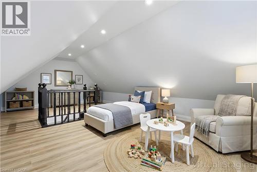 Attic space featuring sloped ceilings, recessed lighting, and wood-finish flooring - 149 Lottridge Street, Hamilton, ON - Indoor Photo Showing Living Room