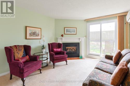 123 - 440 Wellington Street, St. Thomas, ON - Indoor Photo Showing Living Room With Fireplace