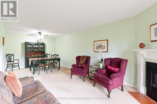 123 - 440 Wellington Street, St. Thomas, ON - Indoor Photo Showing Living Room With Fireplace