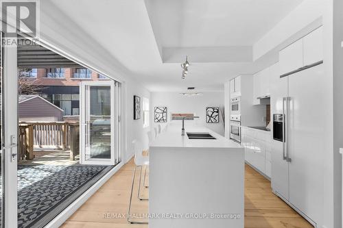 Kitchen opens seamlessly to private patio - 330 Winona Avenue, Ottawa, ON - Indoor