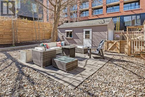 Fully fenced backyard with outdoor seating area - 330 Winona Avenue, Ottawa, ON - Outdoor With Deck Patio Veranda