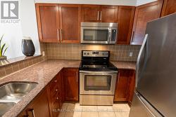 Kitchen with Granite Counters and SS Appliances - 