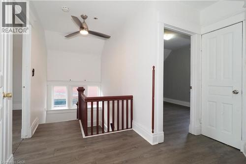 Upper landing featuring wood-finish flooring, white walls, and bright white trim - 205 Duke Street E, Kitchener, ON - Indoor Photo Showing Other Room