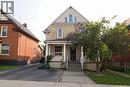 Two-story brick exterior featuring a covered front porch with white columns - 205 Duke Street E, Kitchener, ON  - Outdoor With Facade 