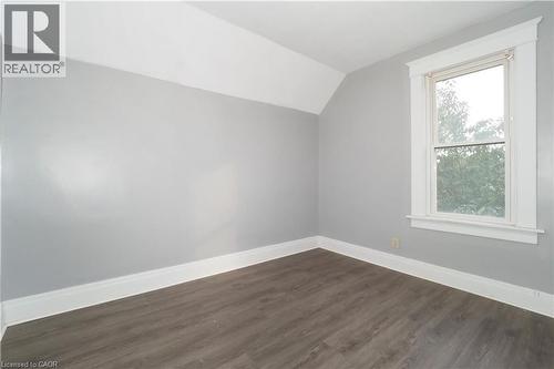 Room featuring light grey walls, white trim, and wood-finish flooring - 205 Duke Street E, Kitchener, ON - Indoor Photo Showing Other Room