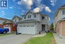 Two-story residence featuring a stone facade and light-colored siding - 512 Hidden Creek Drive, Kitchener, ON  - Outdoor 