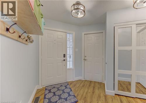 Entryway featuring wood-finish flooring and light blue wall color - 512 Hidden Creek Drive, Kitchener, ON - Indoor Photo Showing Other Room