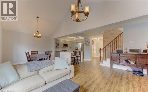 Spacious open-concept interior featuring vaulted ceilings and recessed lighting - 512 Hidden Creek Drive, Kitchener, ON - Indoor Photo Showing Living Room