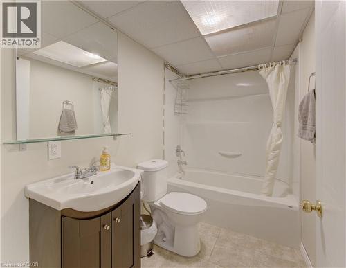 Full bathroom featuring a white bathtub/shower combination, a toilet, and a vanity with an integrated sink - 512 Hidden Creek Drive, Kitchener, ON - Indoor Photo Showing Bathroom
