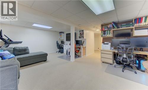 Spacious finished lower level featuring recessed lighting, a drop ceiling, and carpet flooring - 512 Hidden Creek Drive, Kitchener, ON - Indoor Photo Showing Other Room