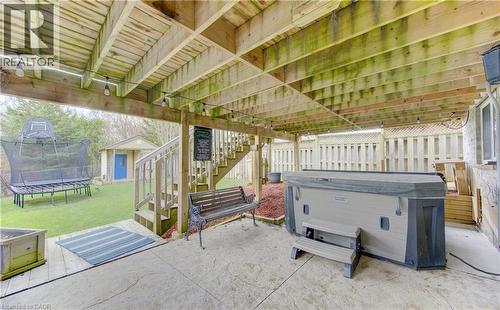 Under-deck patio area stamped concrete surface - 512 Hidden Creek Drive, Kitchener, ON - Outdoor With Deck Patio Veranda With Exterior