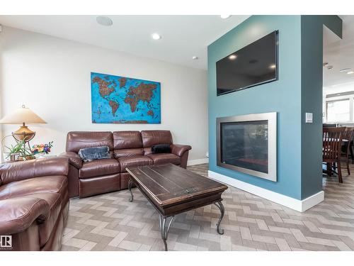 9629 84 Av Nw, Edmonton, AB - Indoor Photo Showing Living Room With Fireplace