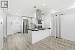 Kitchen with island gas cooktop - 