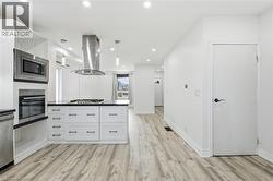 Bright beautiful kitchen with built-in appliances. - 