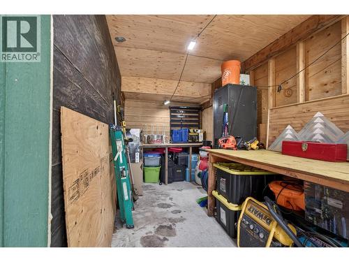 Covered under-deck space offering flexible use as a workshop, storage, or hobby area, with future potential to enclose for additional interior square footage. - 374 Kildare Way, Vernon, BC - Indoor