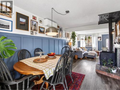 8114 River Road, Oliver, BC - Indoor Photo Showing Dining Room With Fireplace