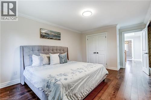 Bedroom featuring wood-finish flooring, white baseboards, crown molding, and a flush-mount ceiling light - 1264 Kane Road, Mississauga, ON - Indoor Photo Showing Bedroom
