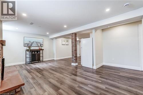 Spacious interior featuring wood-finish flooring, recessed lighting, and white baseboards - 1264 Kane Road, Mississauga, ON - Indoor