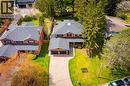 Brick two-story residence featuring a dark gray shingle roof and a two-car garage - 1264 Kane Road, Mississauga, ON  - Outdoor 