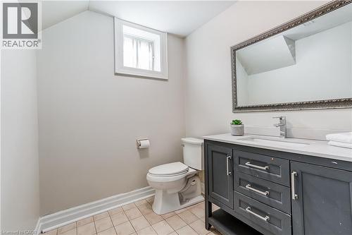 Bathroom featuring a dark grey vanity with a white countertop and an undermount sink - 1264 Kane Road, Mississauga, ON - Indoor Photo Showing Bathroom