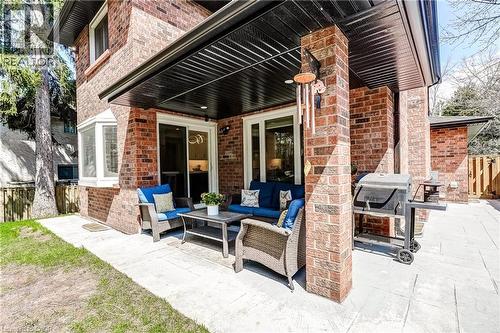 Expansive brick exterior featuring a covered patio with stamped concrete flooring - 1264 Kane Road, Mississauga, ON - Outdoor With Deck Patio Veranda