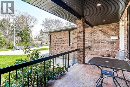 Inviting brick porch with a brick paver surface, detailed with a wrought iron railing - 1264 Kane Road, Mississauga, ON - Outdoor With Exterior