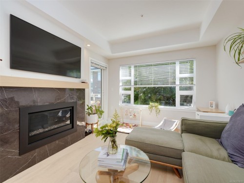 206-9861 Third St, Sidney, BC - Indoor Photo Showing Living Room With Fireplace