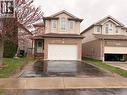 Two-story residence featuring a brick and siding exterior, an attached garage, and a paved driveway - 1126 Copper Leaf Crescent, Kitchener, ON  - Outdoor 