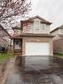 Brick and siding exterior with an integrated two-car garage - 1126 Copper Leaf Crescent, Kitchener, ON  - Outdoor 
