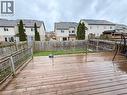 Spacious wood deck with railing and a perimeter wood fence enclosing a grass yard - 1126 Copper Leaf Crescent, Kitchener, ON  - Outdoor With Deck Patio Veranda With Exterior 