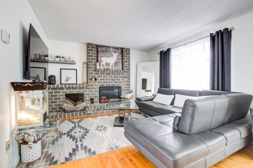 Salon - 38 Rue Carmen, Granby, QC - Indoor Photo Showing Living Room With Fireplace