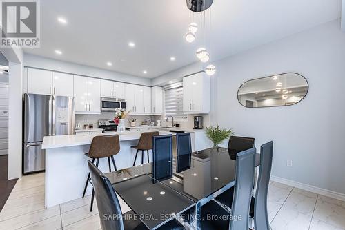 Open Concept Kitchen and Dining - 325 Trudeau Drive E, Milton, ON - Indoor Photo Showing Other Room