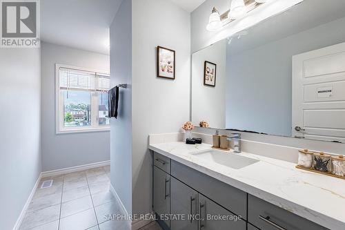 Common Washroom with Large window and Tub - 325 Trudeau Drive E, Milton, ON - Indoor Photo Showing Bathroom