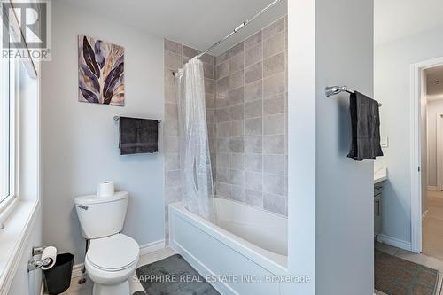Common Washroom with Large window and Tub - 325 Trudeau Drive E, Milton, ON - Indoor Photo Showing Bathroom