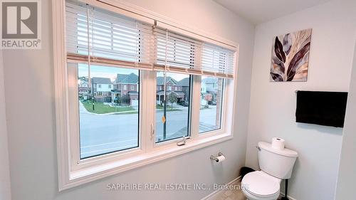 Common Washroom with Large window and Tub - 325 Trudeau Drive E, Milton, ON - Indoor Photo Showing Bathroom