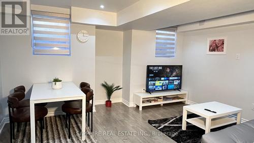 Basement living and Dining with large windows - 325 Trudeau Drive E, Milton, ON - Indoor Photo Showing Dining Room