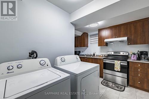 Basement Laundry - 325 Trudeau Drive E, Milton, ON - Indoor Photo Showing Laundry Room