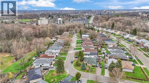 Aerial perspective showcasing a residential neighborhood with varied house styles and rooflines - 22 Blackhorne Crescent, Kitchener, ON - Outdoor With View